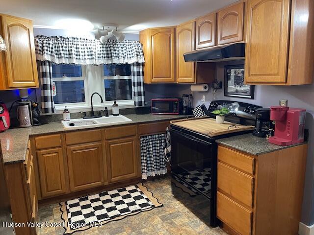 170 Broome Street Catskill, NY 12414 - Photo 3 of 18 a kitchen with a sink a stove cabinets and a window