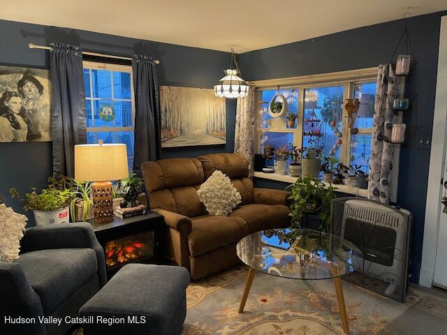170 Broome Street Catskill, NY 12414 - Photo 5 of 18 a living room with furniture fireplace and a window