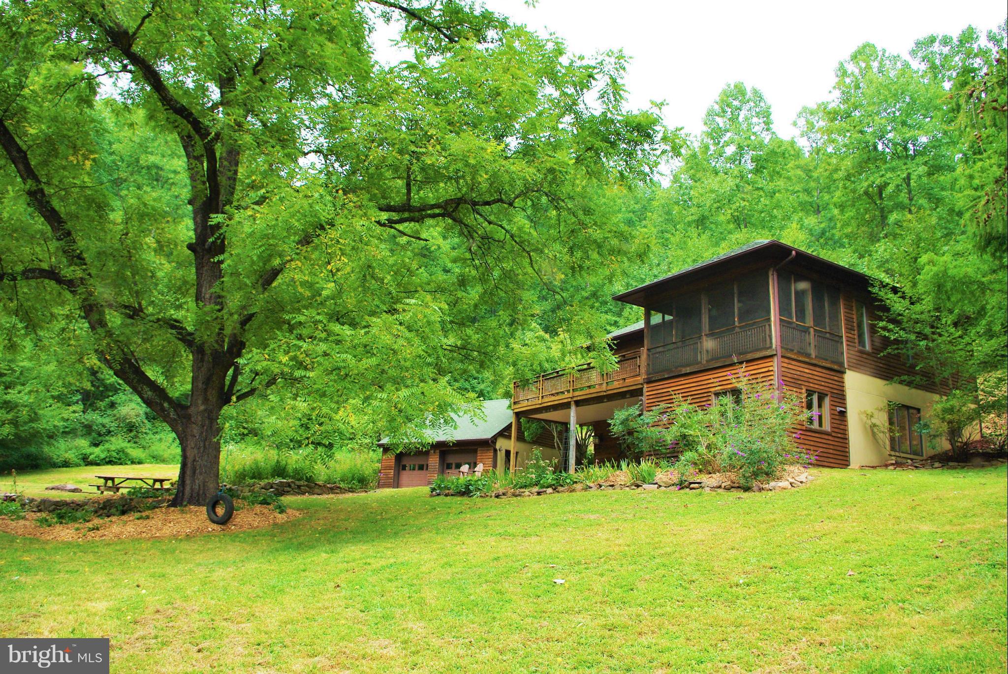 416 Rolling Road Sperryville, VA 22740 - Photo 2 of 25 The house and front lawn