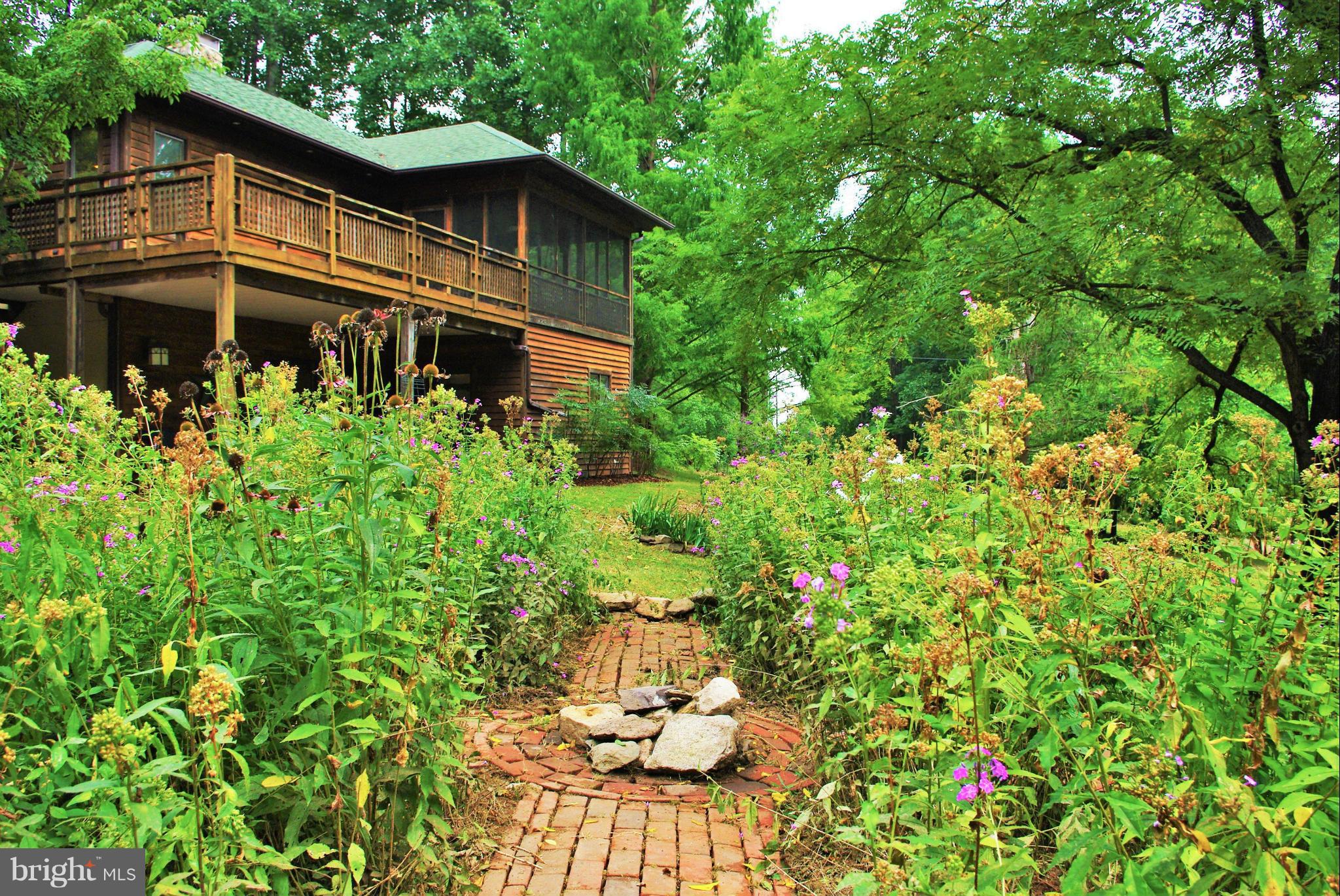 416 Rolling Road Sperryville, VA 22740 - Photo 20 of 25 Perennial garden with brick walk