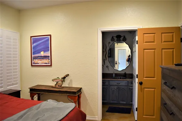 a bathroom with a sink a mirror and shower