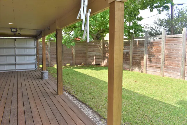 a view of a porch with wooden floor