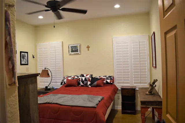 a bedroom with a bed and a table in it