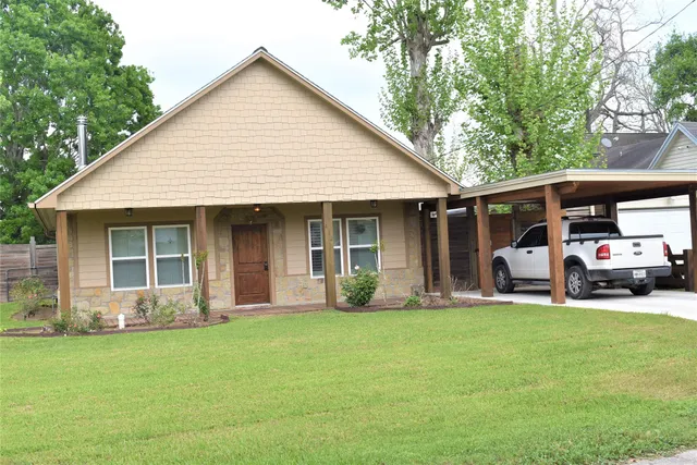 a front view of a house with garden