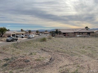 2413 Nez Perce Road Fort Mohave, AZ 86426 - Photo 2 of 2 a view of a yard with car parked