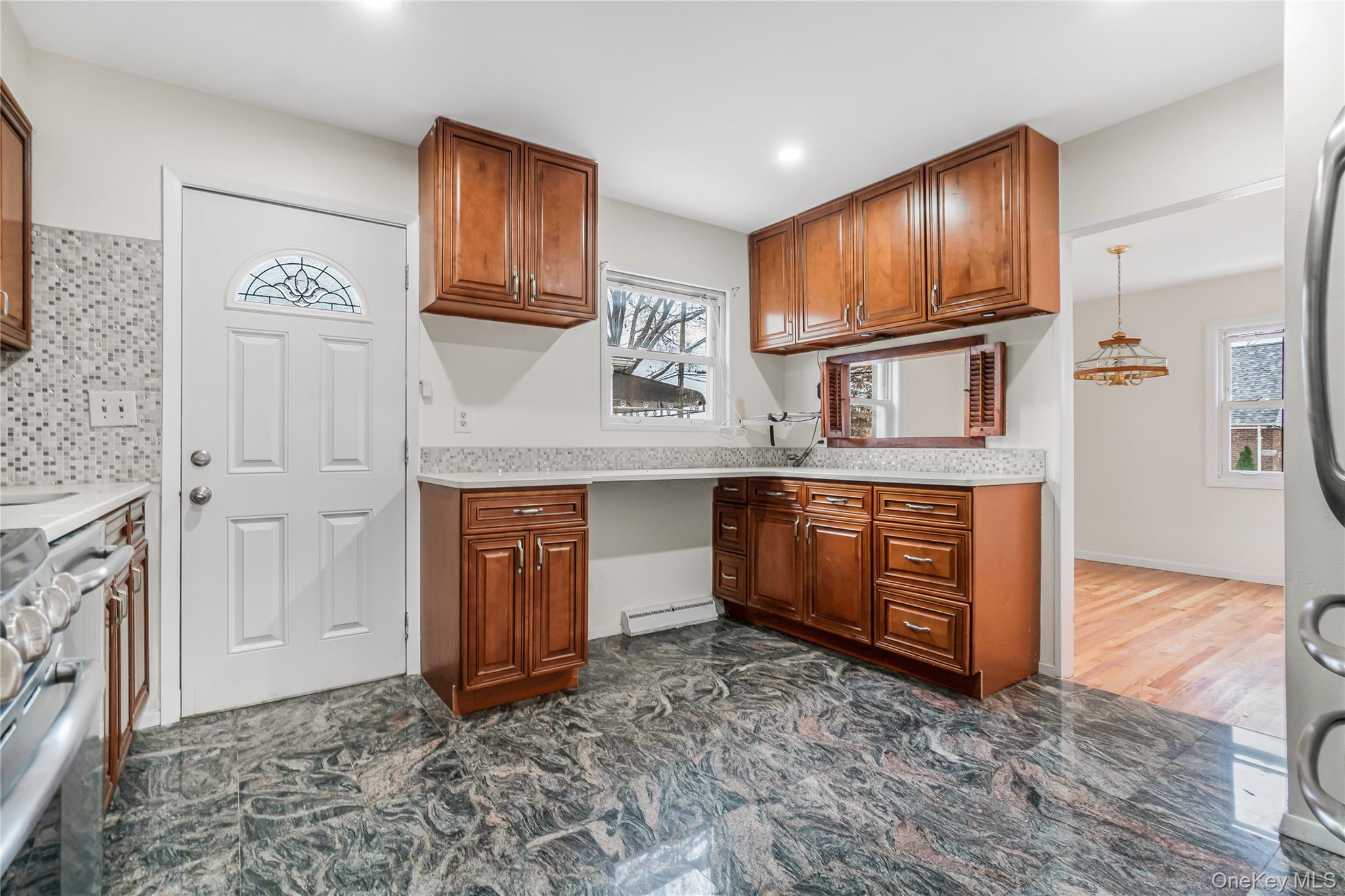 243-25 132nd Road Queens, NY 11422 - Photo 18 of 41 a spacious bathroom with a granite countertop sink and a mirror