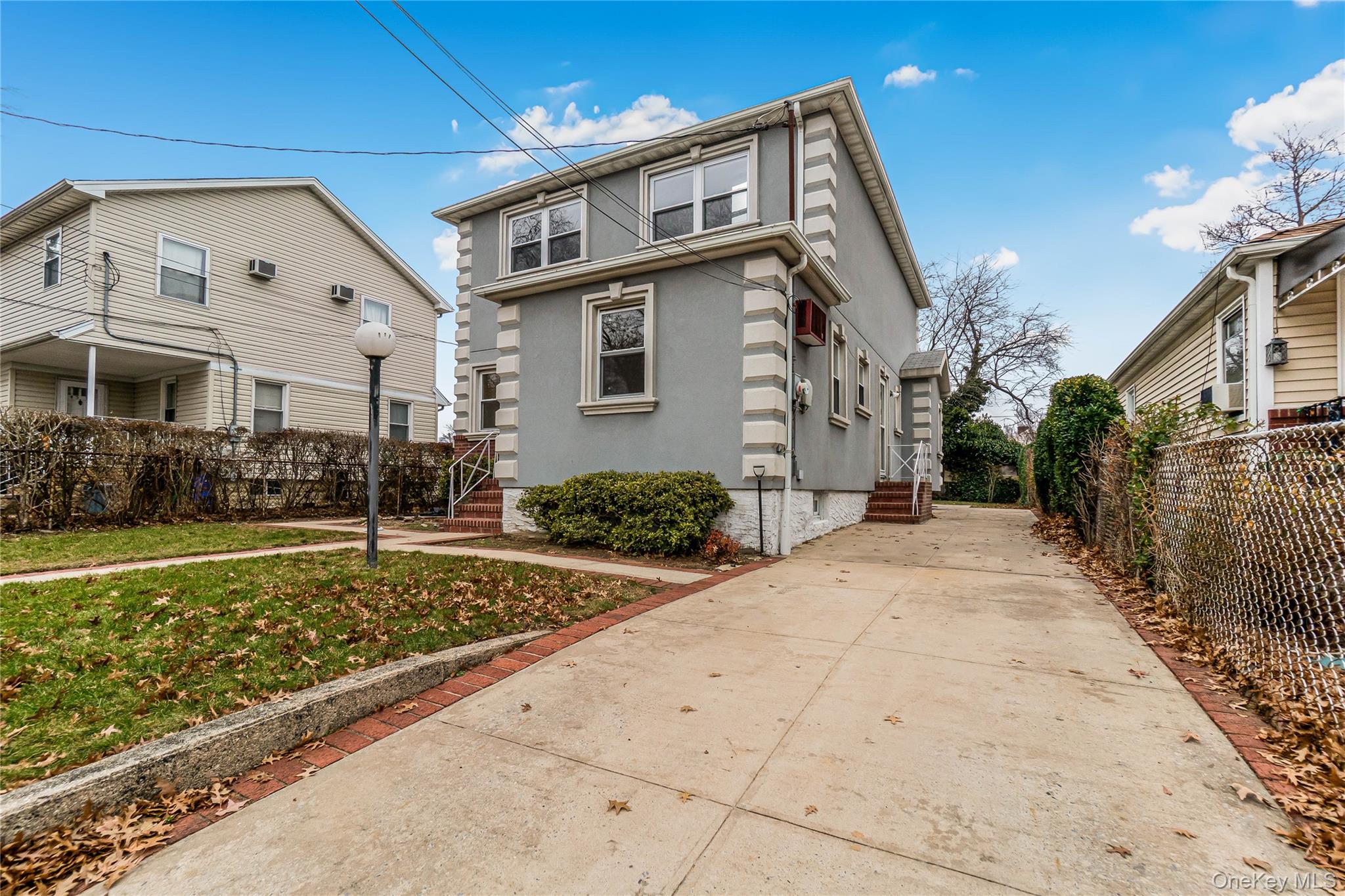 243-25 132nd Road Queens, NY 11422 - Photo 2 of 41 a front view of a house with garden
