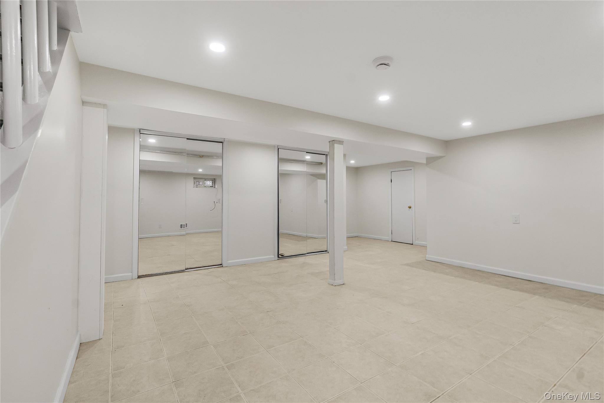 243-25 132nd Road Queens, NY 11422 - Photo 21 of 41 an empty room with an entryway