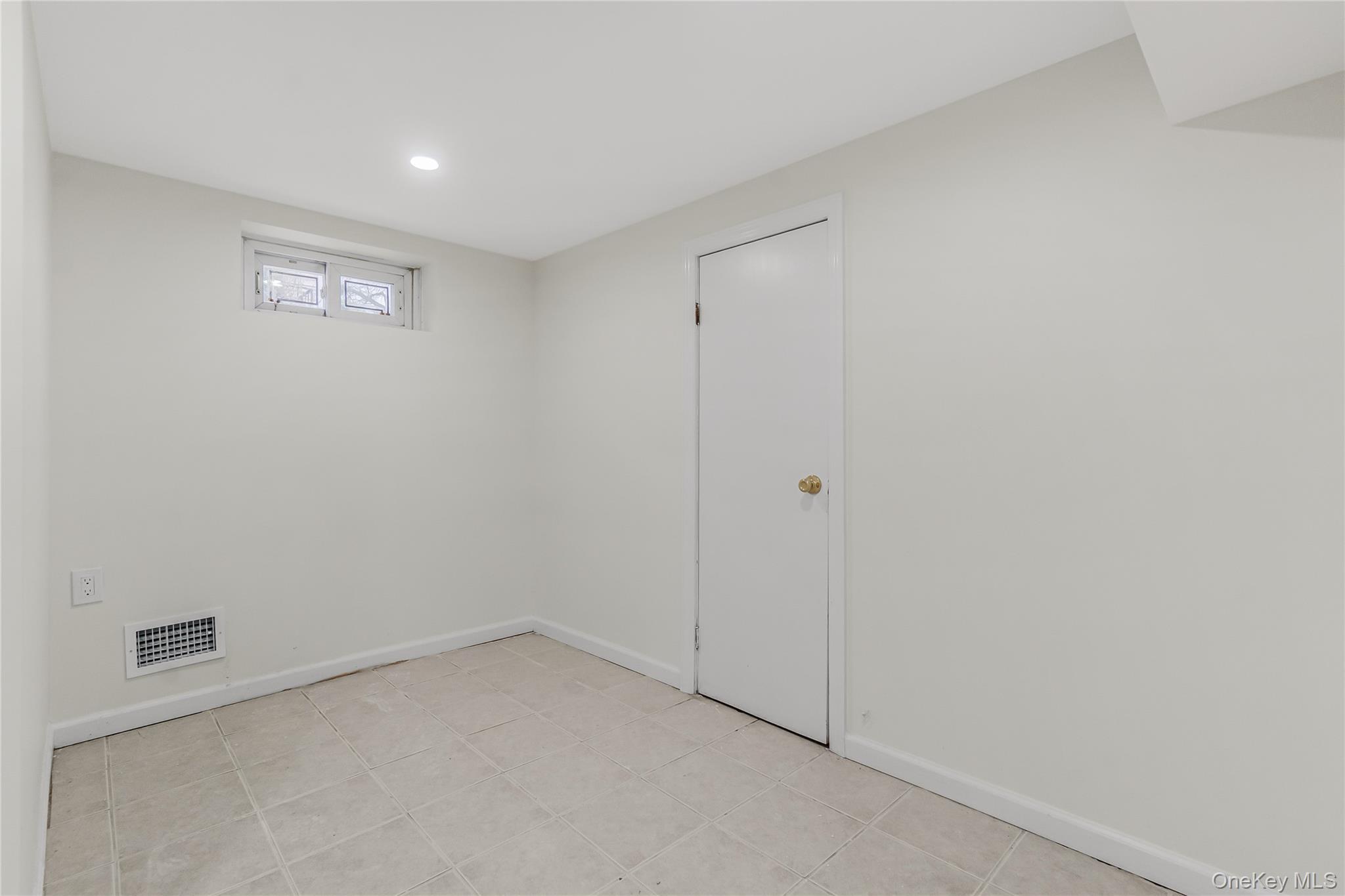 243-25 132nd Road Queens, NY 11422 - Photo 23 of 41 a view of an empty room