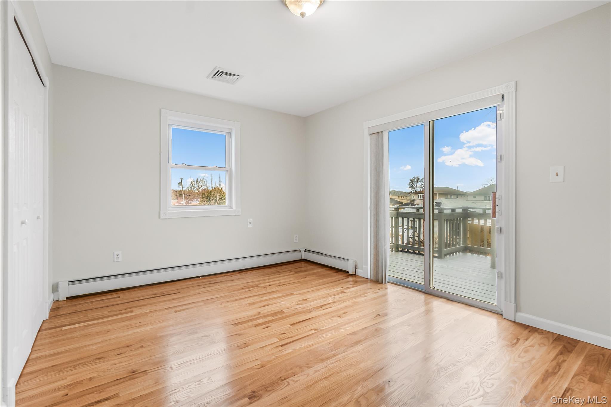 243-25 132nd Road Queens, NY 11422 - Photo 26 of 41 a view of an empty room with glass door