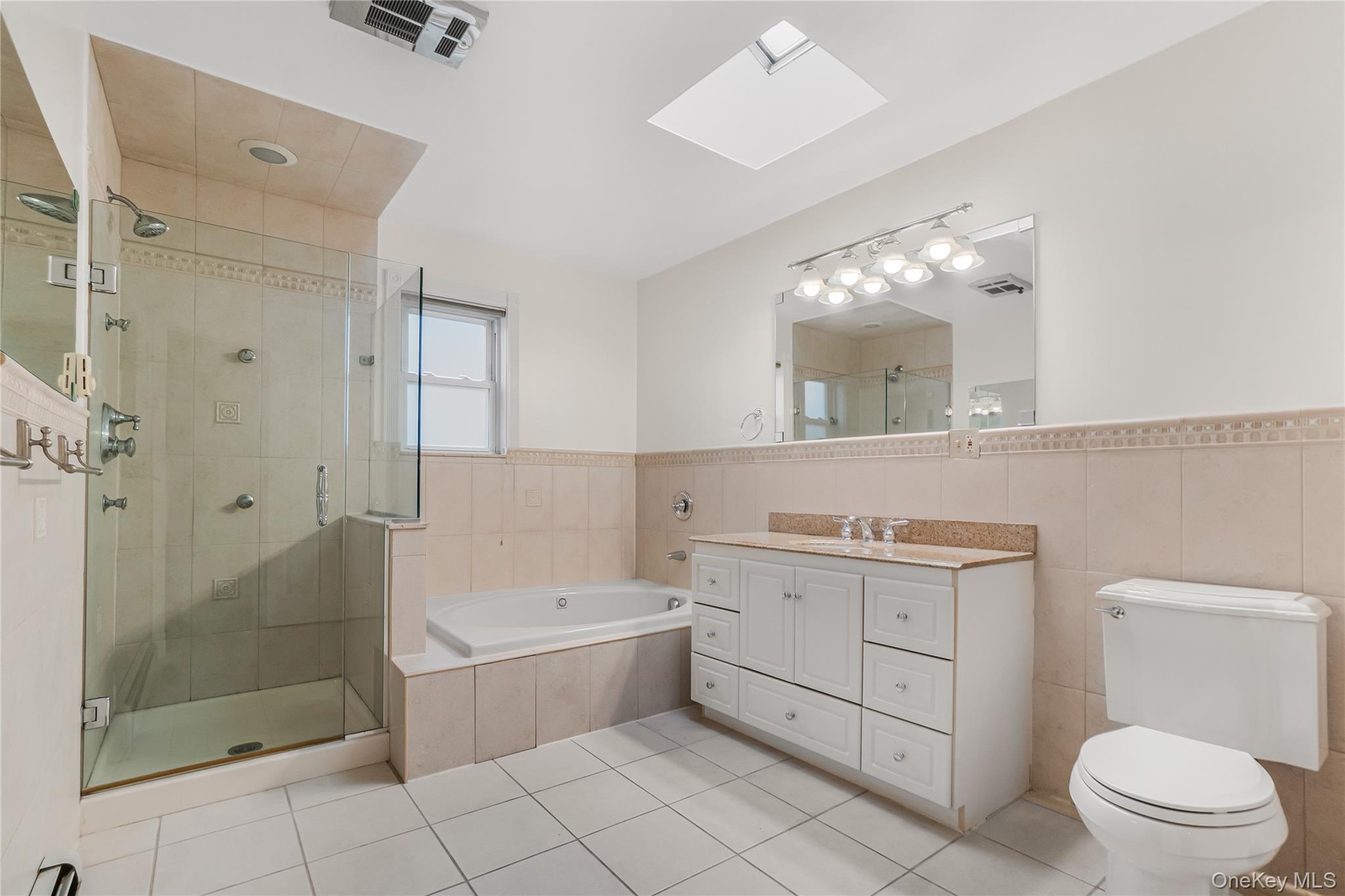 243-25 132nd Road Queens, NY 11422 - Photo 28 of 41 a bathroom with a sink a toilet and shower