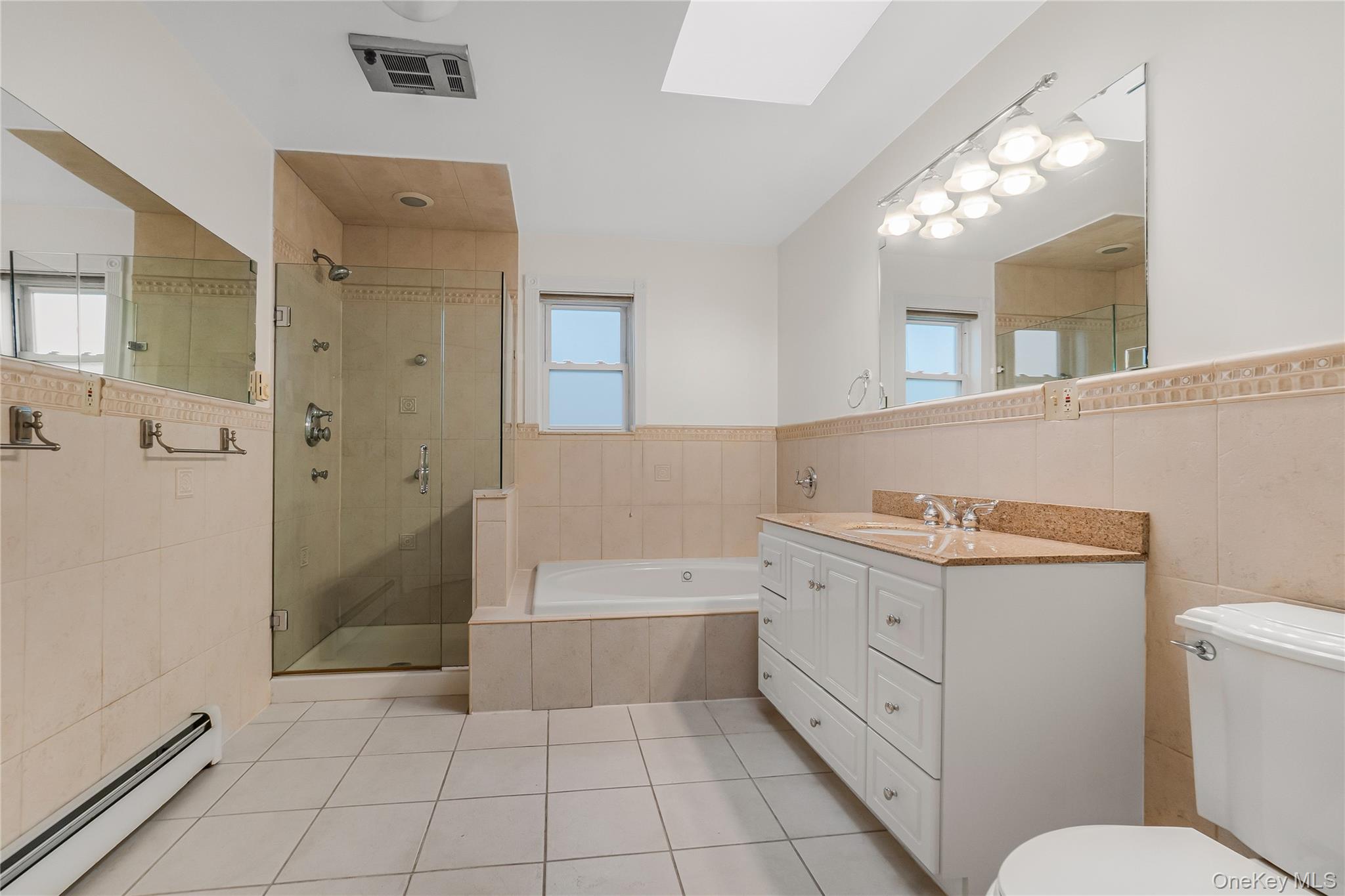 243-25 132nd Road Queens, NY 11422 - Photo 35 of 41 a bathroom with a sink a toilet and shower