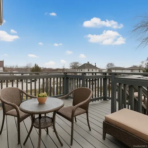 a view of balcony with furniture