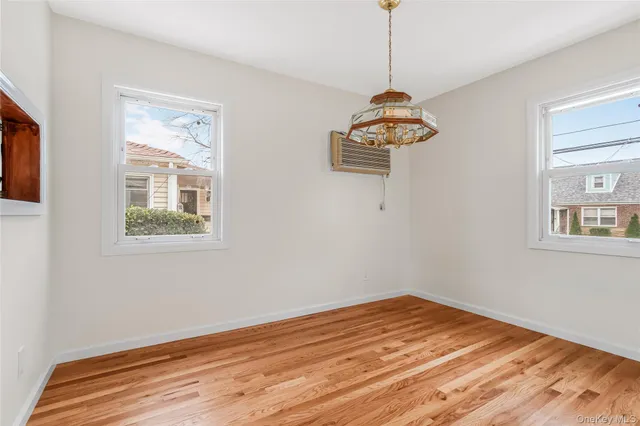 a room with a window and a wooden floor