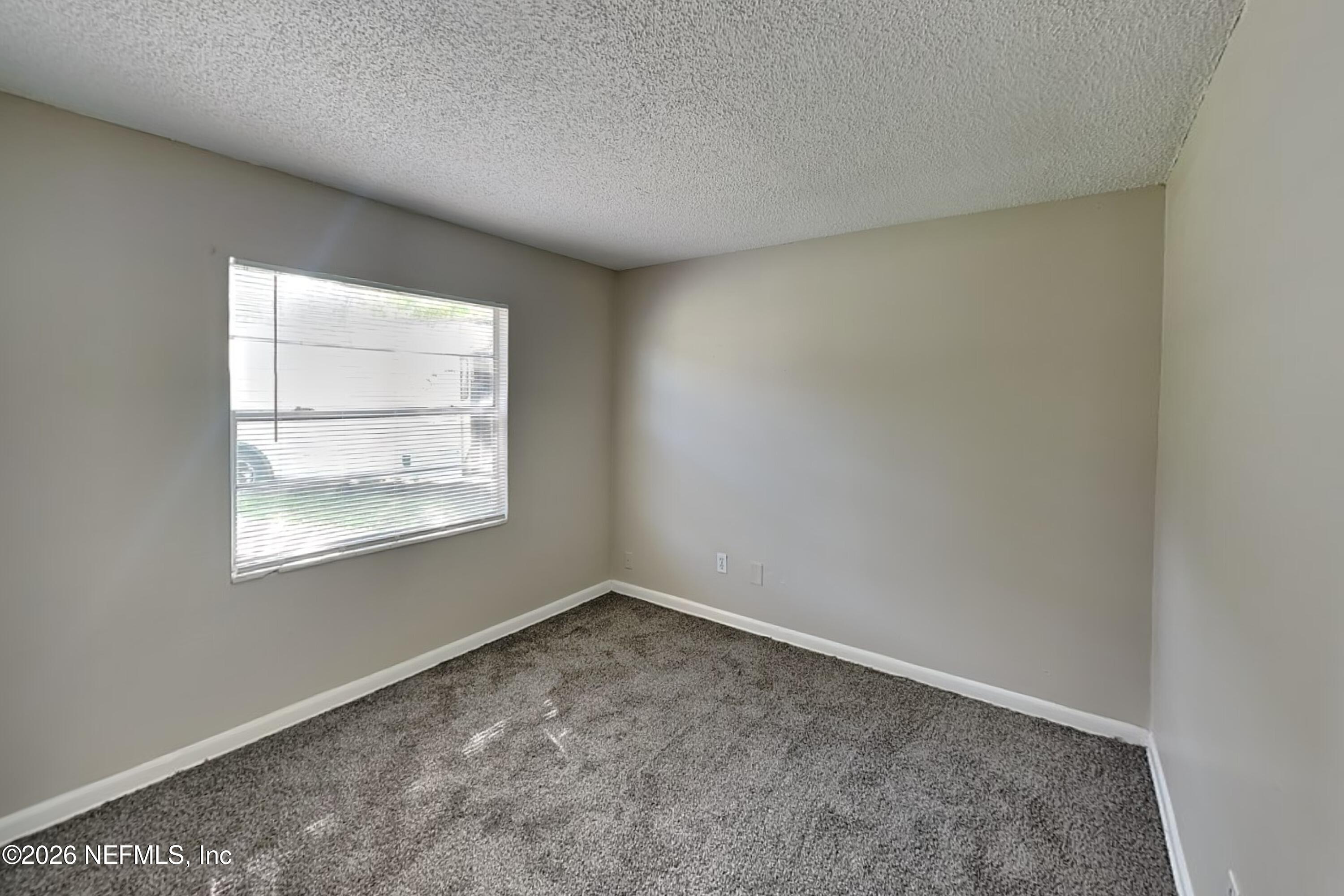 4888 Strato Road West Jacksonville, FL 32210 - Photo 13 of 19 12_Bedroom-01_Image_1qreBLOPW1