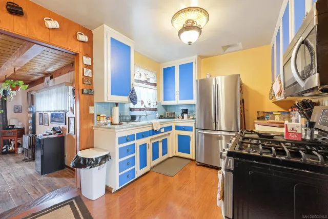 a kitchen with stainless steel appliances granite countertop a stove refrigerator and a stove