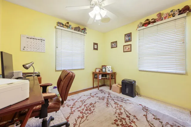 a bedroom with a bed and a desk