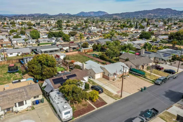 an aerial view of residential houses and city view