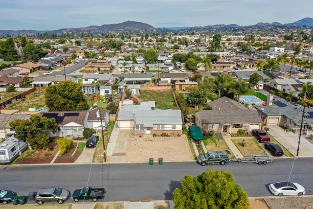 an aerial view of residential houses with outdoor space