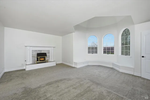 a spacious bathroom with a double vanity sink a mirror and a bathtub