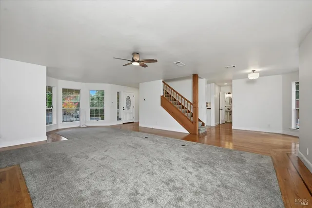 a backyard of a house with a tree