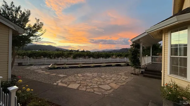 a view of swimming pool with lake view and sitting space