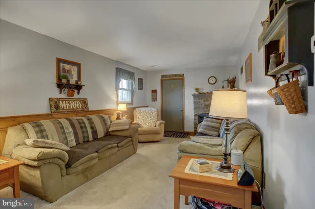a view of living room with furniture and a flat screen tv