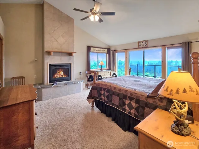 a bed room with a bed and a fireplace