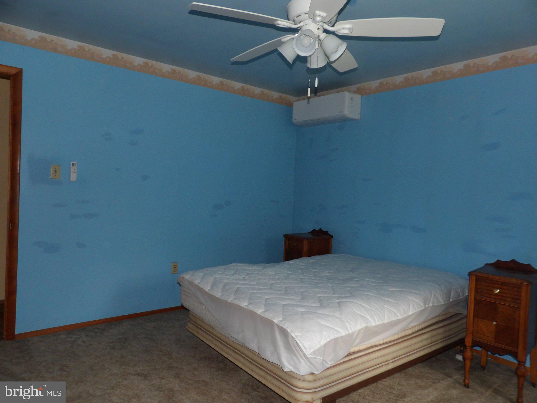 1045 Lockport Road Lewistown, PA 17044 - Photo 27 of 51 Serene blue bedroom with ceiling fan.