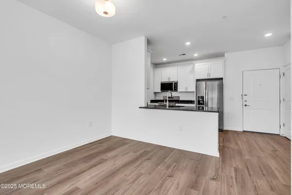 a view of kitchen with wooden floor