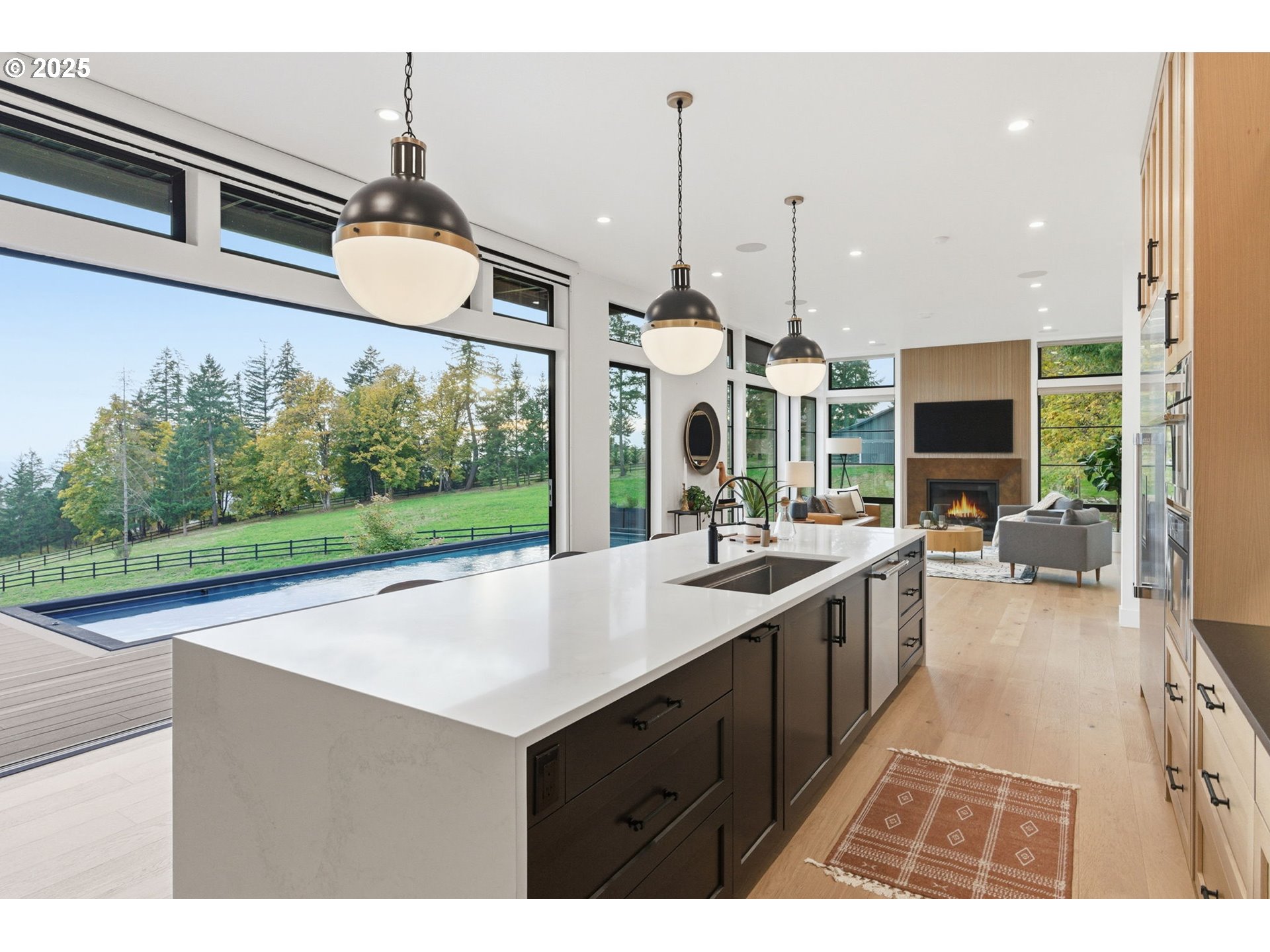 15299 Northeast Quarry Road Newberg, OR 97132 - Photo 13 of 46 a kitchen with stainless steel appliances kitchen island a sink stove and cabinets