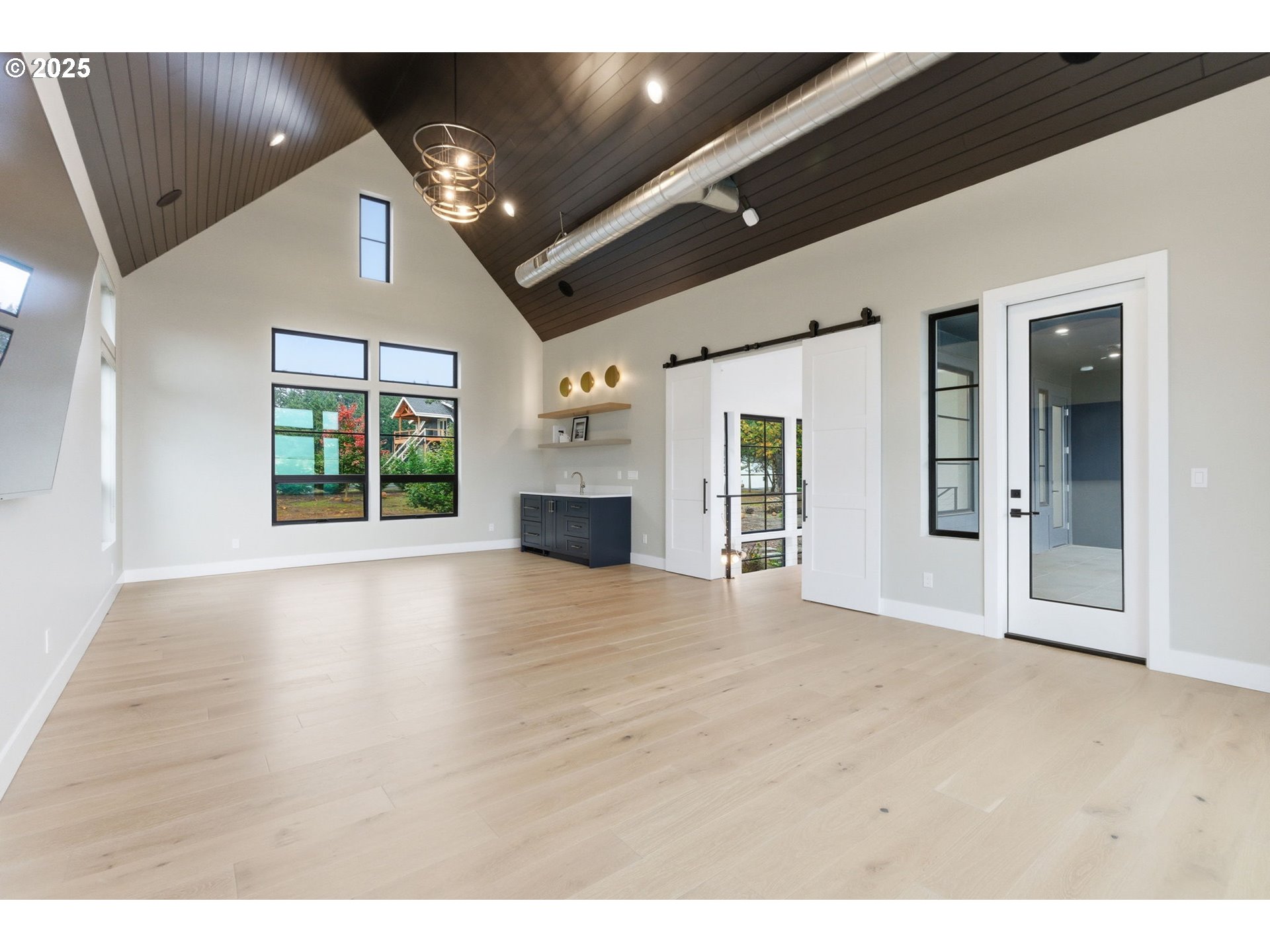 15299 Northeast Quarry Road Newberg, OR 97132 - Photo 36 of 46 wooden floor in an empty room with a window