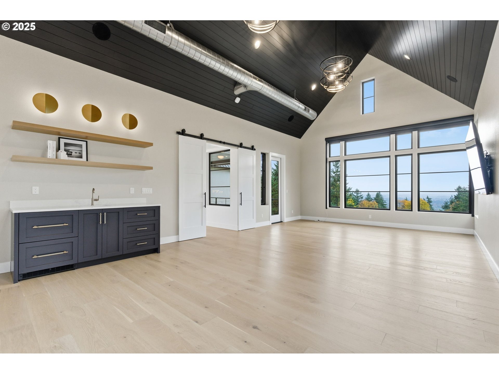 15299 Northeast Quarry Road Newberg, OR 97132 - Photo 37 of 46 a view of an empty room with a window and kitchen view