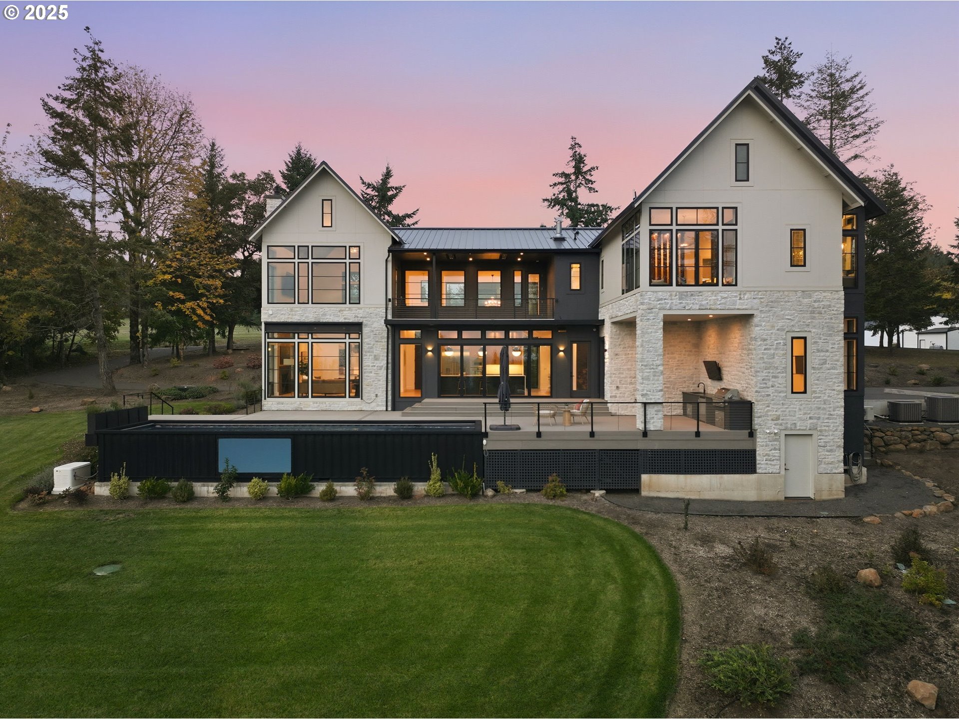 15299 Northeast Quarry Road Newberg, OR 97132 - Photo 4 of 46 a front view of a house with a garden and swimming pool
