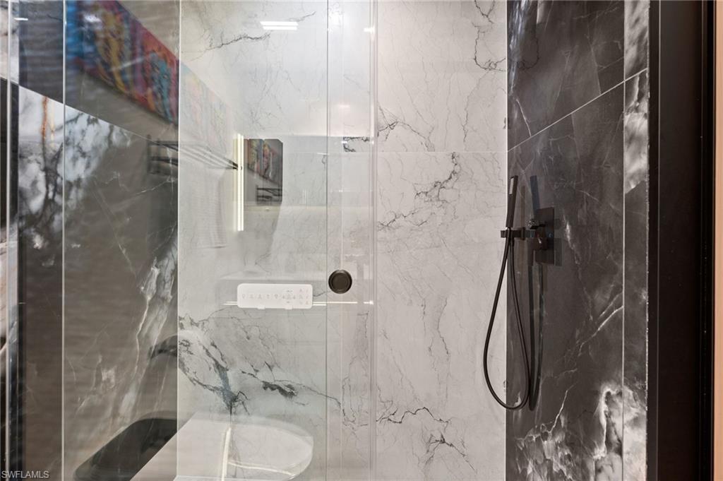1100 Pine Ridge Road, Unit B103 Naples, FL 34108 - Photo 28 of 38 a bathroom with a shower