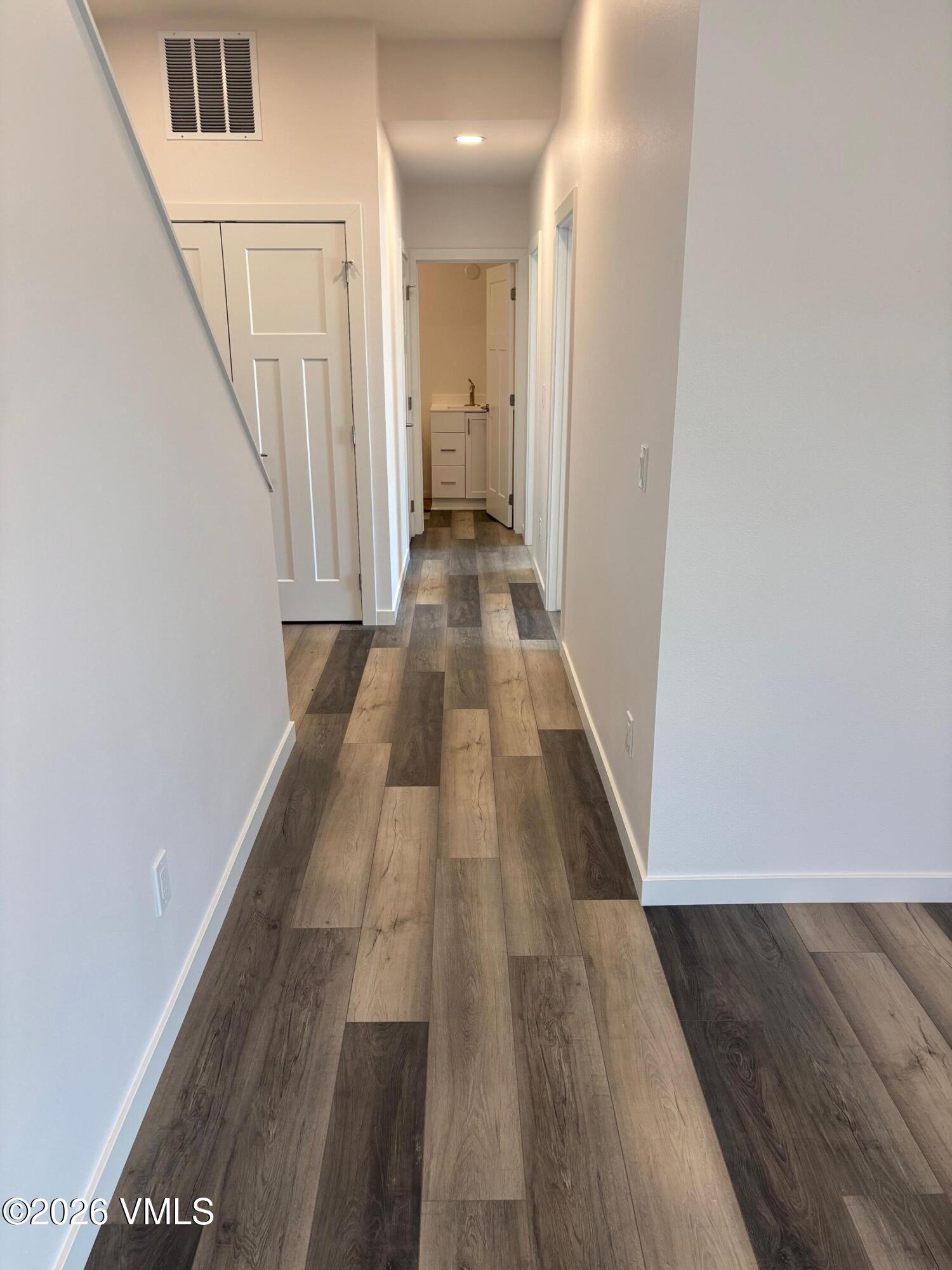 525 Blackhawk Road Gypsum, CO 81637 - Photo 16 of 23 a view of a hallway with wooden floor