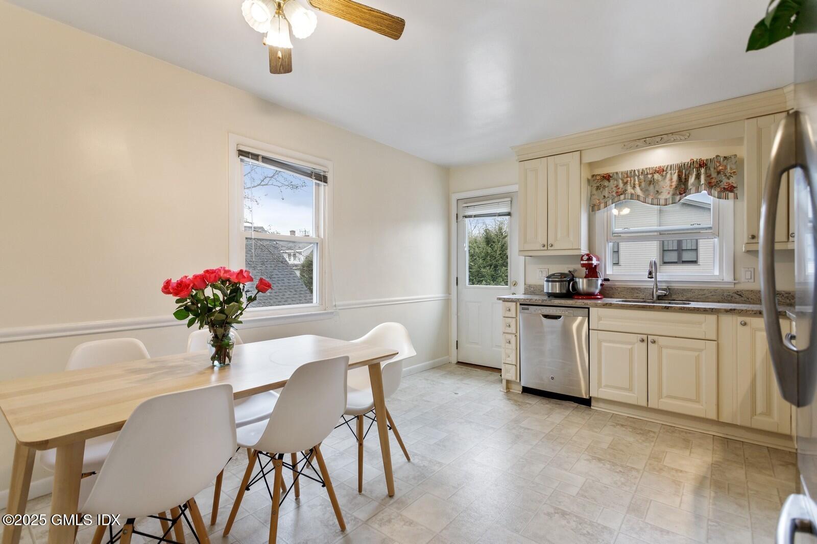 15 Neil Lane, Unit 2 Riverside, CT 06878 - Photo 3 of 10 a kitchen with granite countertop white cabinets and white appliances