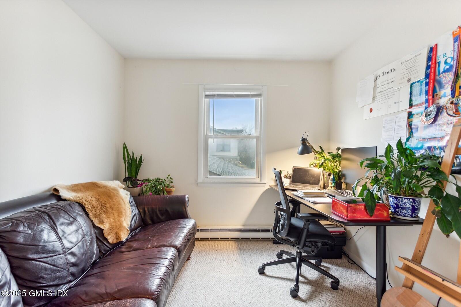 15 Neil Lane, Unit 2 Riverside, CT 06878 - Photo 8 of 10 a living room with furniture flowerpot and a window