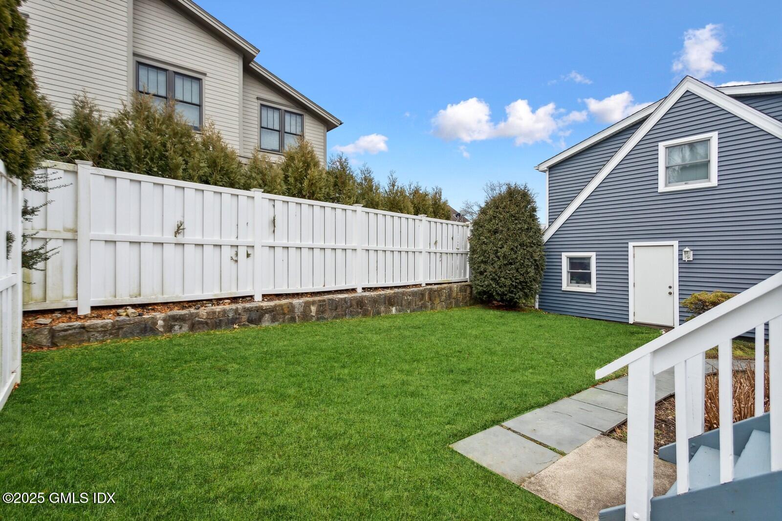 15 Neil Lane, Unit 2 Riverside, CT 06878 - Photo 10 of 10 a view of a house with backyard and garden
