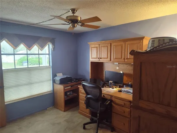 a workspace with furniture and window