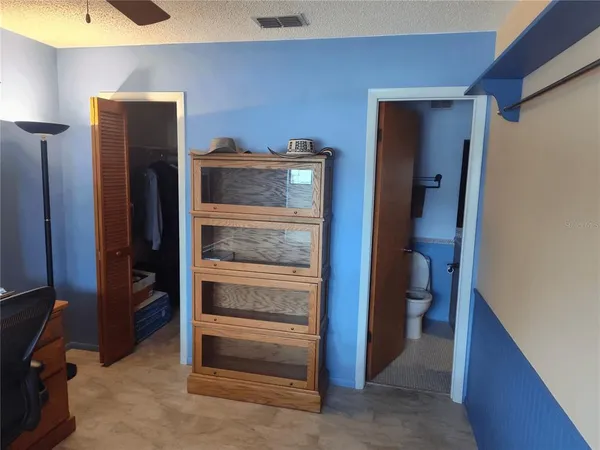 a bathroom with a toilet and a sink