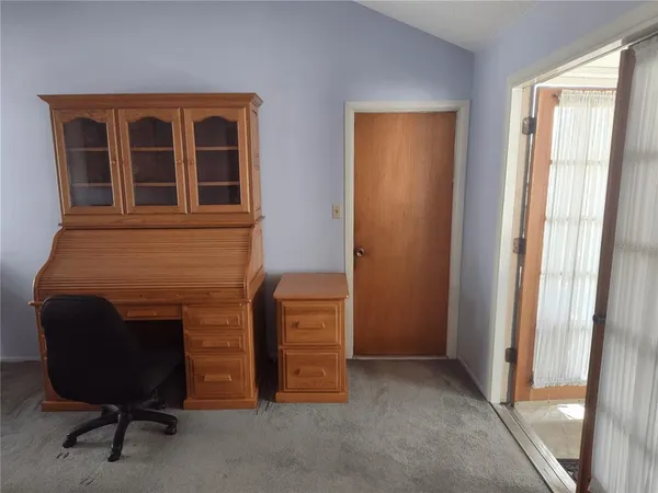 a bed room with a bed and mirror