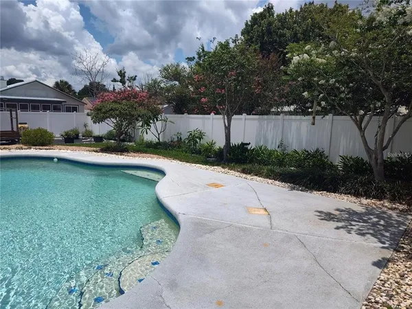 a view of swimming pool with a garden