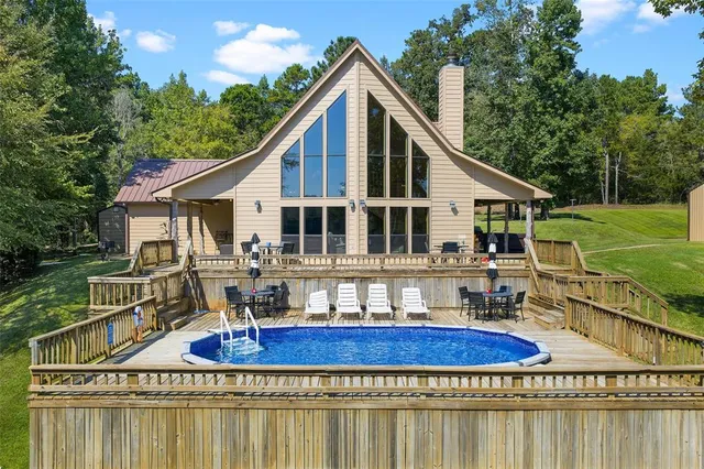 a front view of a house with a yard table and chairs