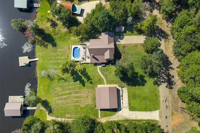 an aerial view of residential house with outdoor space and parking