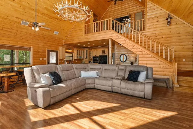 a view of a patio with couches and potted plants