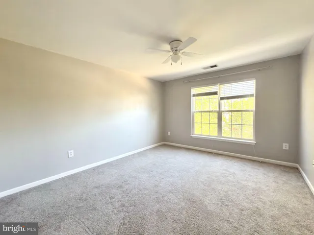 a view of an empty room with a bathroom