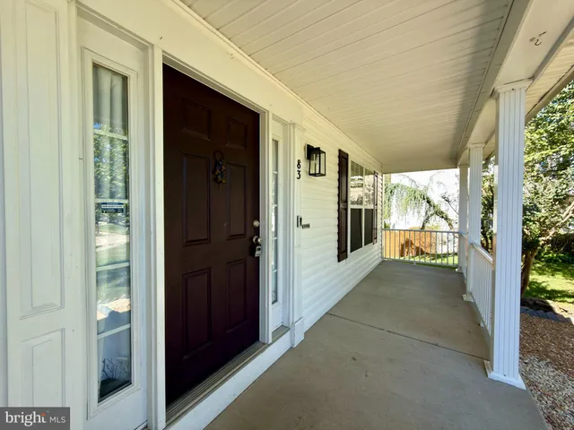 a large kitchen with stainless steel appliances granite countertop a stove a sink and a refrigerator