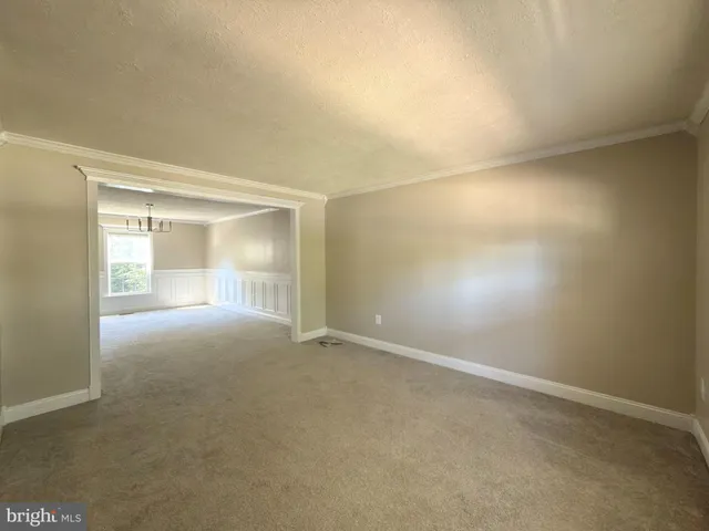 a view of balcony with wooden floor and fence