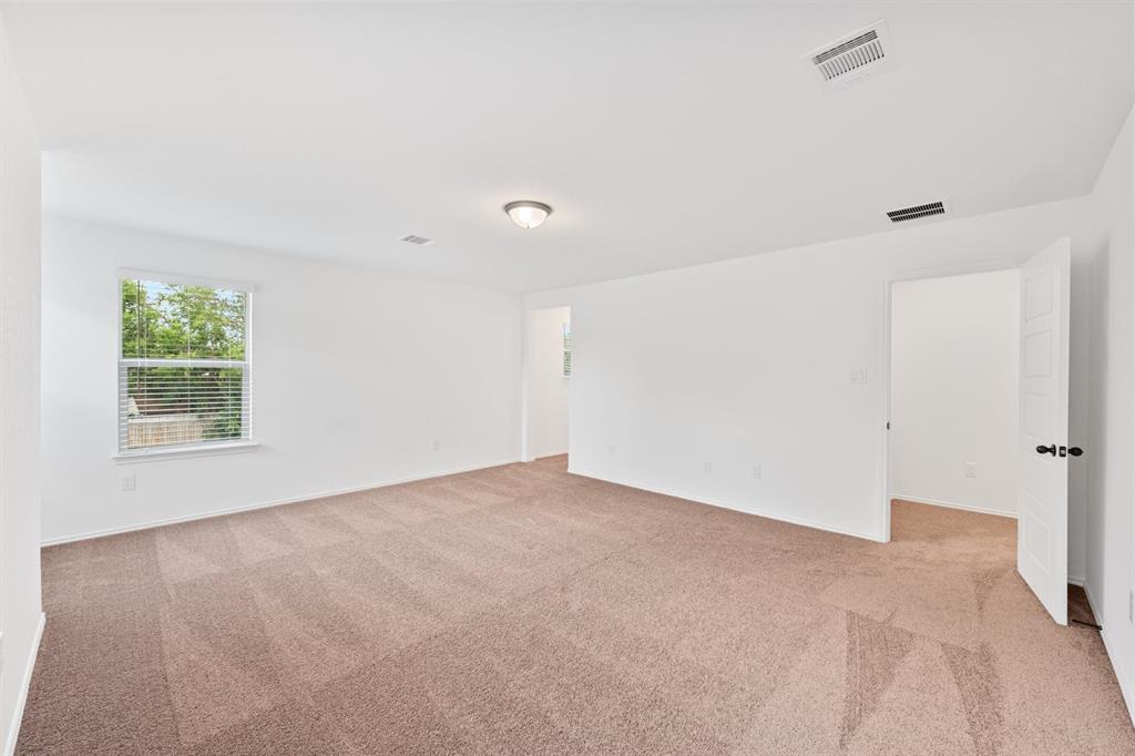 210 McGinnis Trail Kyle, TX 78640 - Photo 7 of 10 a view of an empty room with a window